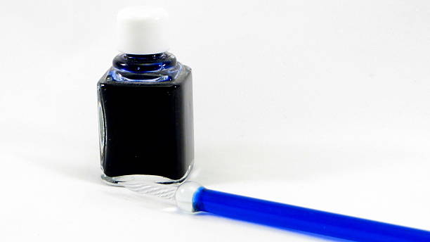 istock inkpot and pen glass white background 462095721