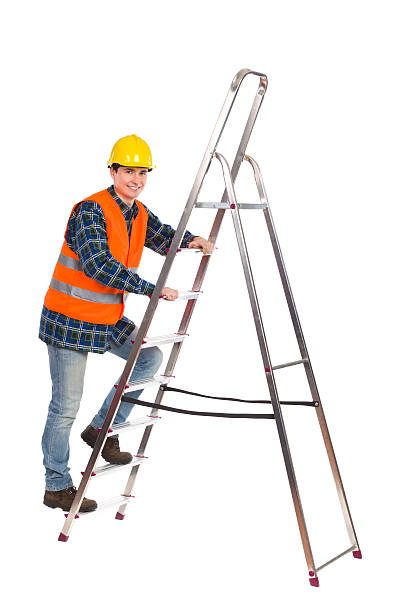 istock Construction worker in reflective clothing climbing a ladder. 462096899