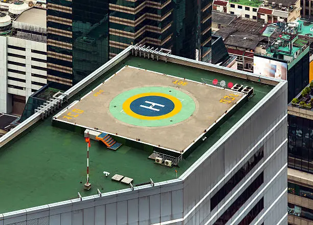 Photo of Helipad (Helicopter landing pad) on roof top building.