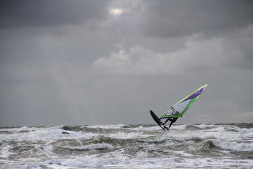 Wind surfer on stormy water
