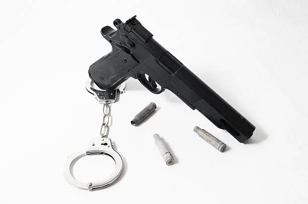 istock Pistol Gun and Handcuffs 462111753