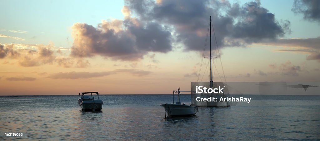 Luxury boats on water at Pereybere beach during sunset Luxury boats on the water at Pereybere beach at sunset Mauritius Stock Photo