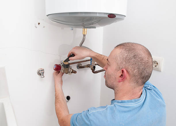 istock Plumber repairing an electric boiler 462120527