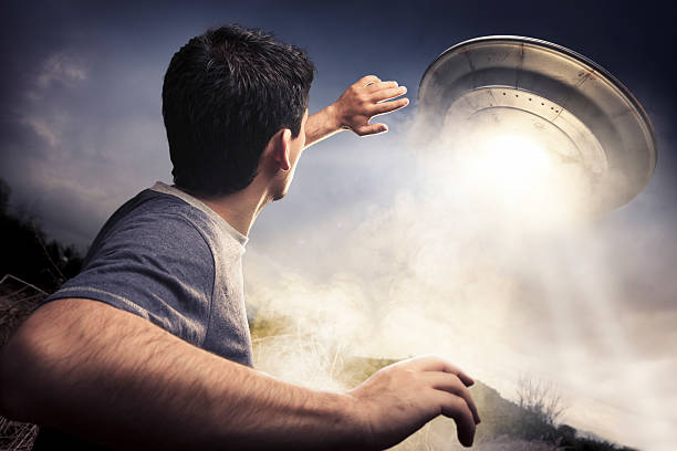 Man about to be abducted by aliens man running away from a UFO kidnapping stock pictures, royalty-free photos & images