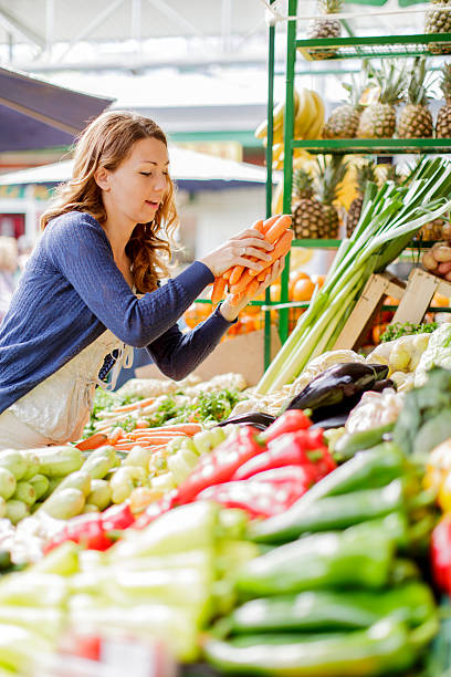 istock Young woman at the market 462129075