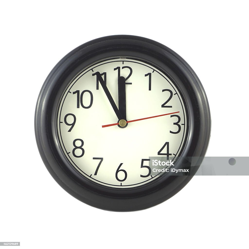 Wall clock isolated on white close up Big round wall clock shows almost twelve isolated on white close up Clock Stock Photo