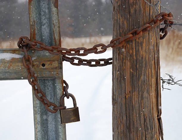 Locked gate in winter stock photo