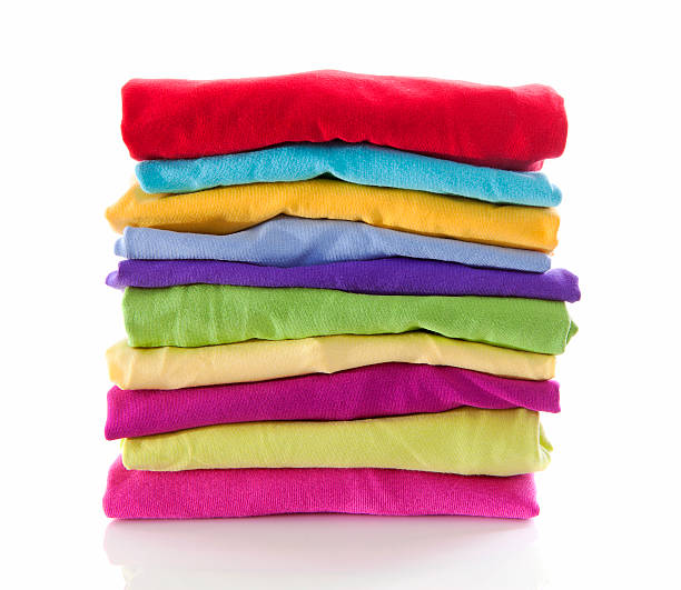 istock Pile of colorful clothes over white background 462138677