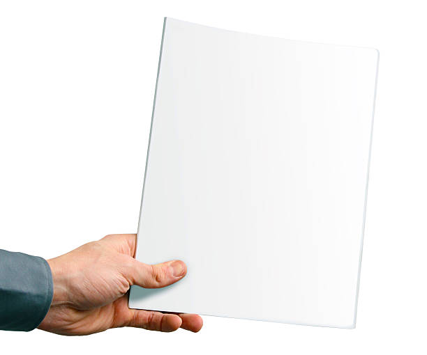 istock blank magazine cover in the hand isolated on white 462139005