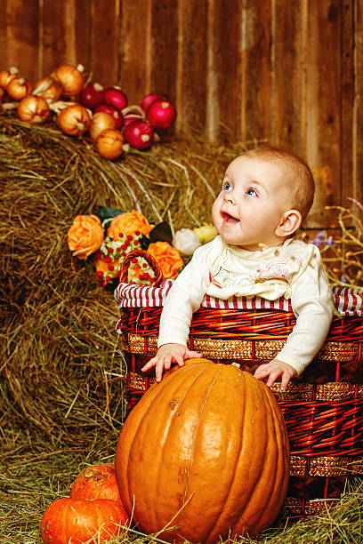istock Girl and halloween pumpkins 462139665