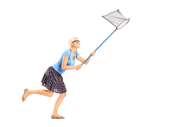 istock Woman running with butterfly net 462141189