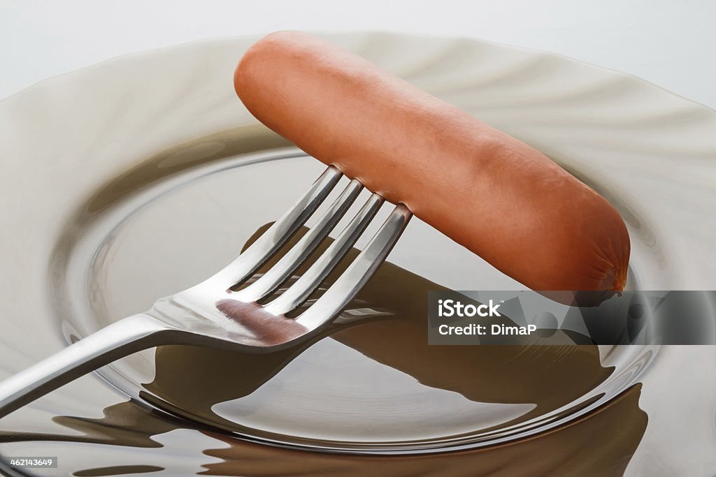 sausage on fork a freshly cooked sausage on a fork Beef Stock Photo