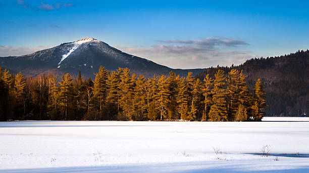 Whiteface mountain peak Whiteface mountain peak viewed from the frozen Paradox Bay in Lake Placid, Upstate New York whiteface mountain stock pictures, royalty-free photos & images