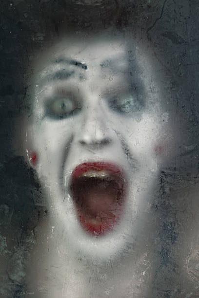 istock Scary face screaming mime for murky glass 462146371