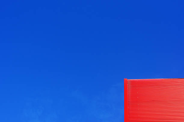 istock industrial facade against blue sky with copy space 462149787