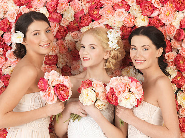 istock three women with background full of roses 462153149
