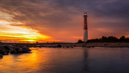 Barnegat Lighthouse at sunset.  Barnegat Lighthouse is a historic landmark located on the northern tip of Long Beach Island.