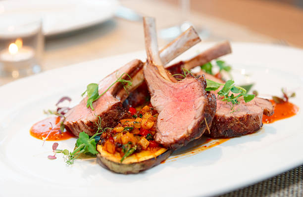 Grilled rack of lamb with vegetables Grilled rack of lamb with vegetables on plate lamb meat photos stock pictures, royalty-free photos & images