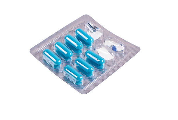 istock Open pack of pills isolated on white background 462154489