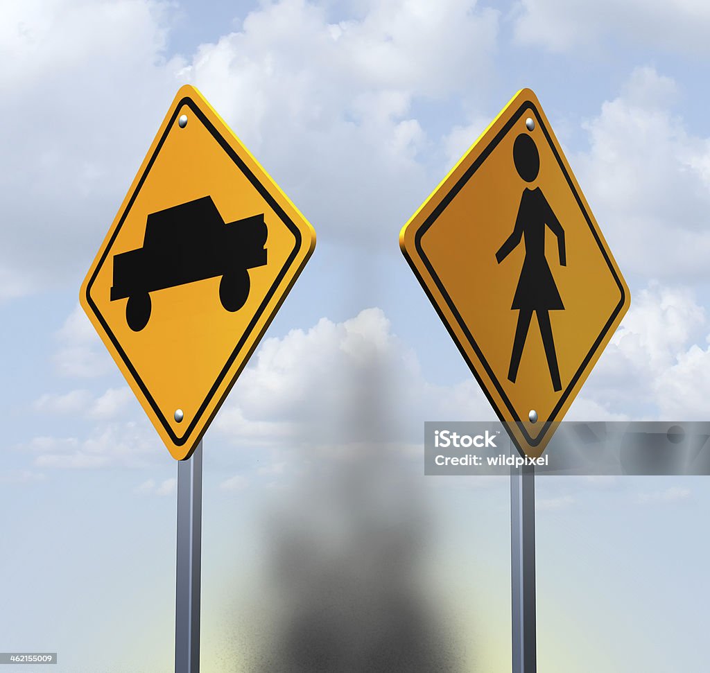 Car Accident Car accident concept with two yellow warning road signs with a car and child icon at a street crossing resulting in a dangerous collision as a symbol of auto insurance and personal injury crash near a school or street corner. Pedestrian Stock Photo
