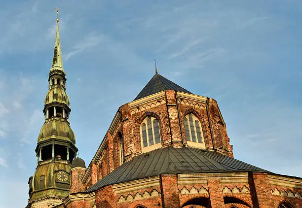 View on dome with golden cockerel in blue sky, St. Peter's Cathedral, Riga, Latvia, Europe