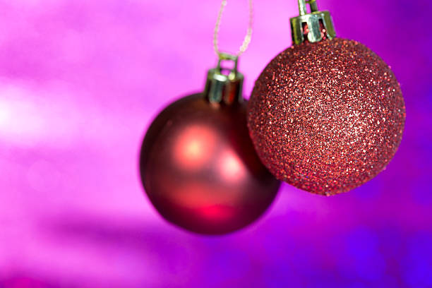Christmas Balls Christmas balls hanging on purple,with copy space to the left. rame stock pictures, royalty-free photos & images