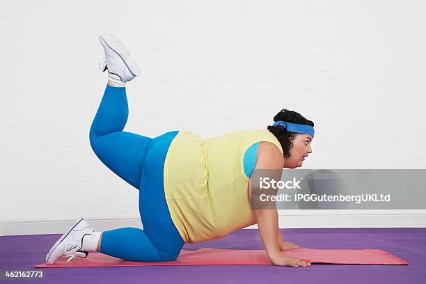 Overweight Woman Doing Aerobic Stretches Stock Photo - Download Image Now - Adult, Aerobics, Aspirations