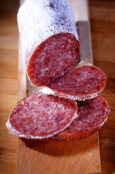 istock seasoned salami on chopping board 462163701