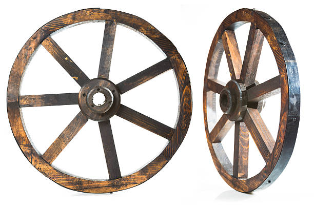 istock Old vintage wood wheel on white 462164203