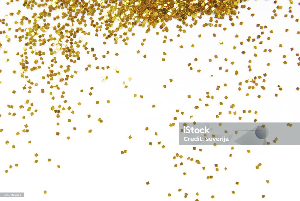 Gold glitter sprinkles down from top of frame golden glitter frame background Confetti Stock Photo