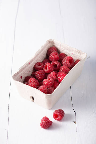 Raspberries in a basket stock photo