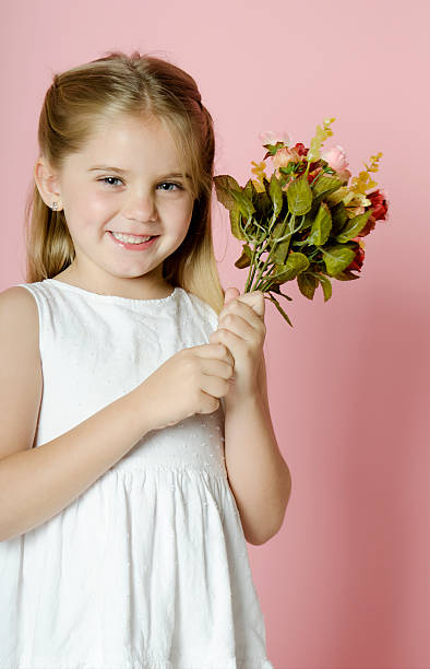 istock little girl whit flowers 462184917