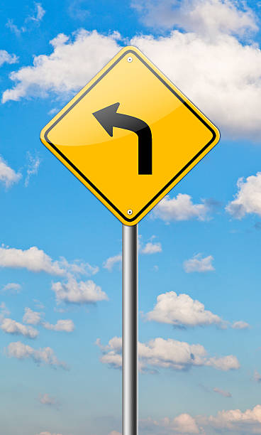 istock Left turn road sign isolated on a blue sky background. 462185889