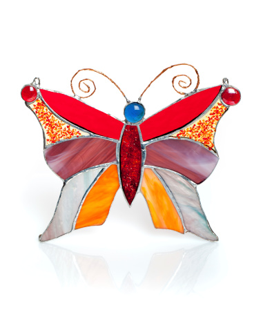 Handmade stained glass butterfly isolated on white