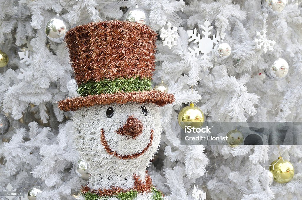 Snowman A Snowman and the white Christmas tree Celebration Stock Photo