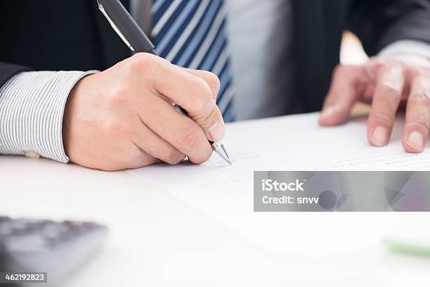 Close Up Of Businessman Signing A Contract Stock Photo - Download Image Now - Adult, Adults Only, Agreement