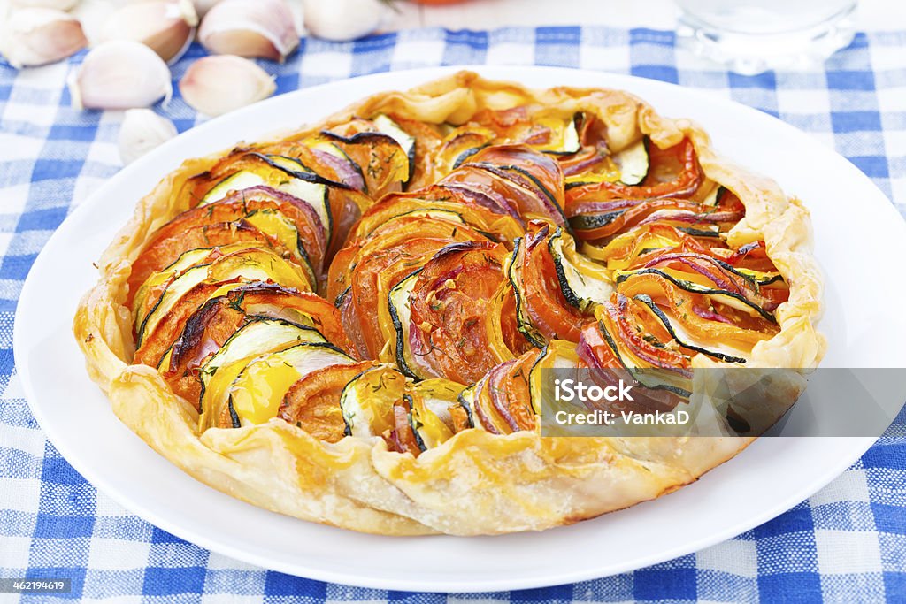 Ratatouille cake Delicious vegetable galette on a white plate Baked Stock Photo