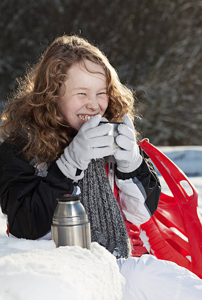 istock Blond girl relaxing in a snowy park 462196107