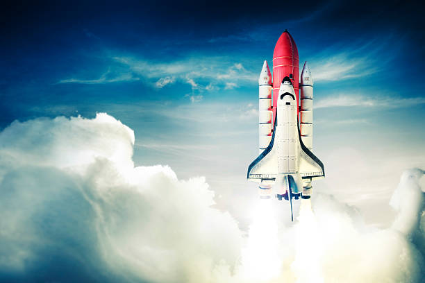 Space shuttle launch over blue sky Space shuttle taking off on a mission rocketship photos stock pictures, royalty-free photos & images