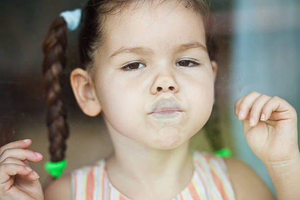 istock Girl waiting by the window 462197571