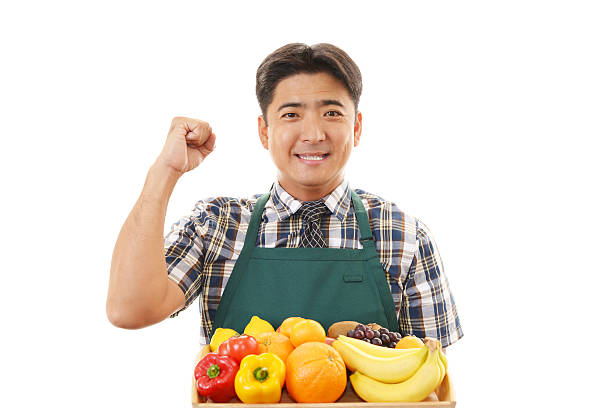 istock Asian man holding vegetables and fruits 462198541