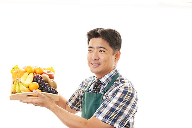 istock Asian man holding fruits 462198753