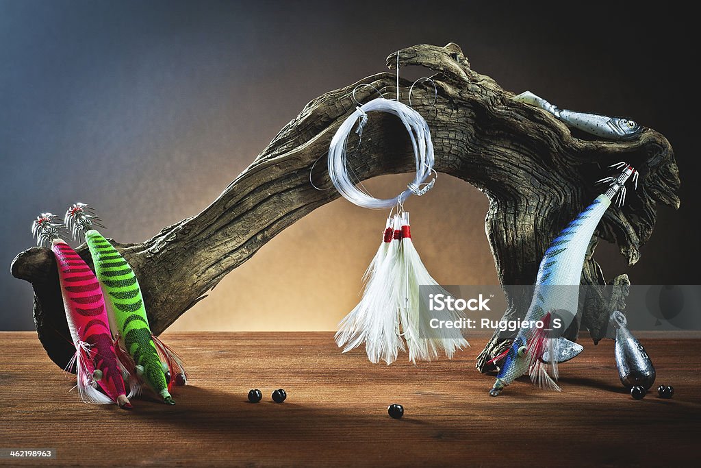 equipment from fisherman artificial bait for fishing with hooks on wood Artificial Stock Photo