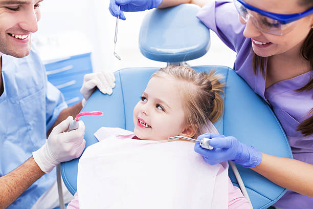 istock Little girl smiling in the dentists office 462202243