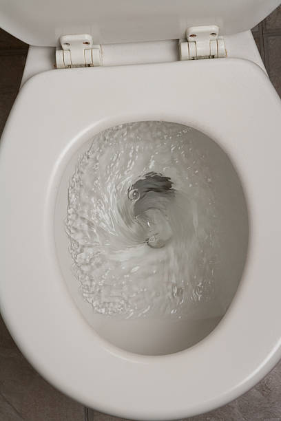 istock An image of a white toilet flushing water 462204149