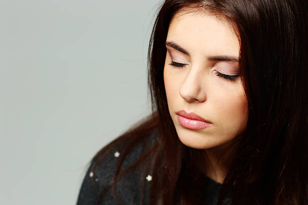 istock young beautiful woman with closed eyes 462206035