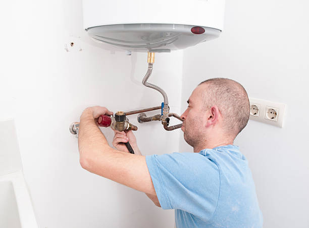 istock Plumber repairing an electric boiler 462207587