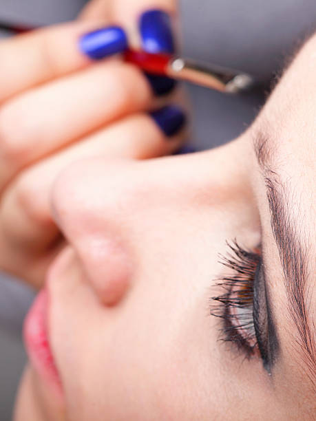 istock Woman applying eyeshadow makeup brush 462207657