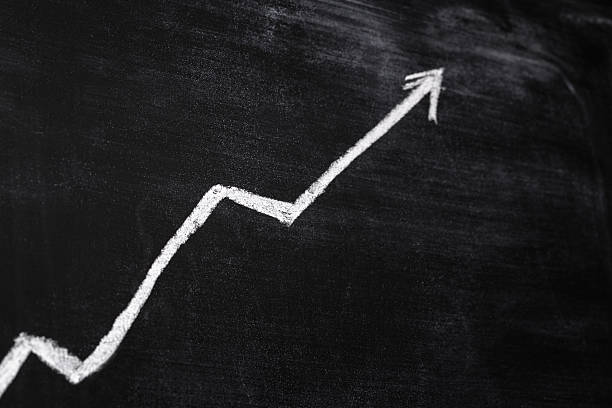 istock A positive rising white line on a black board 462207797