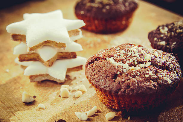 Handmade chocolate muffin with christmas star cookies stock photo